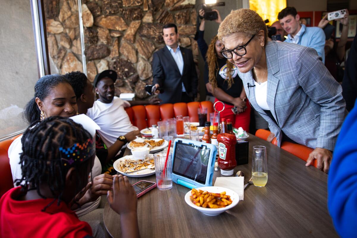 Mayor Karen Bass greets supporters inside Pann's Restaurant in Los Angeles.