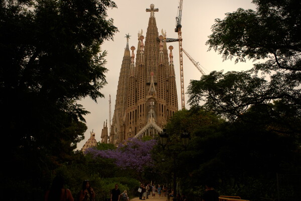 Antoni Gaudí's Basilica of the Sagrada Familia stands in Barcelona, Spain, Sunday, May 31, 2026, as the landmark church prepares for Pope Leo XIV's visit to the city in June. (AP Photo/Emilio Morenatti)