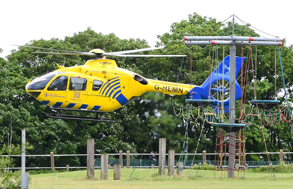 Air Ambulance taking off from a children's playground on nearby Egerton Street