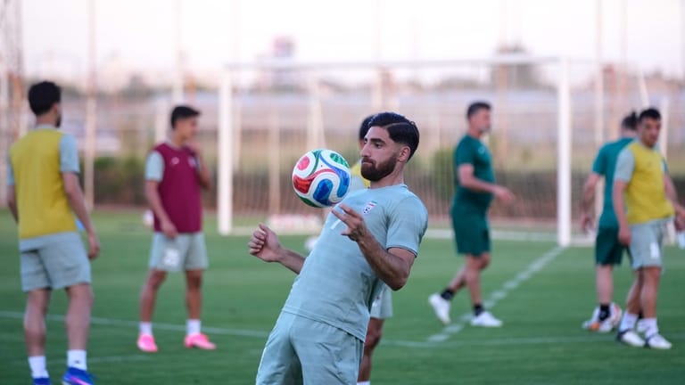 Iran's Alireza Jahanbakhsh works out with teammates during a training...