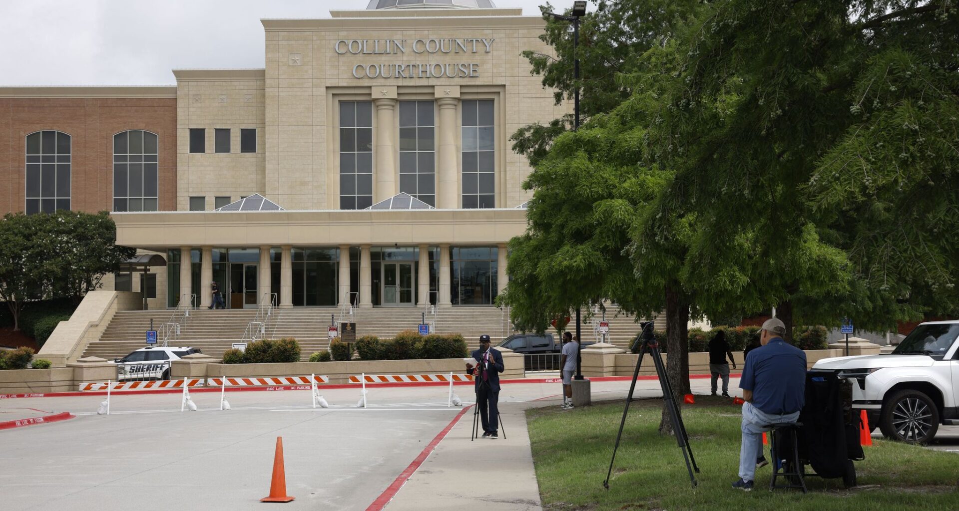 Media members gather in front of Collin County Courthouse, Friday, June 5, 2026, in McKinney during Karmelo Anthony’s trial. Anthony is charged in the stabbing death of student-athlete Austin Metcalf at a Frisco ISD track meet last year.