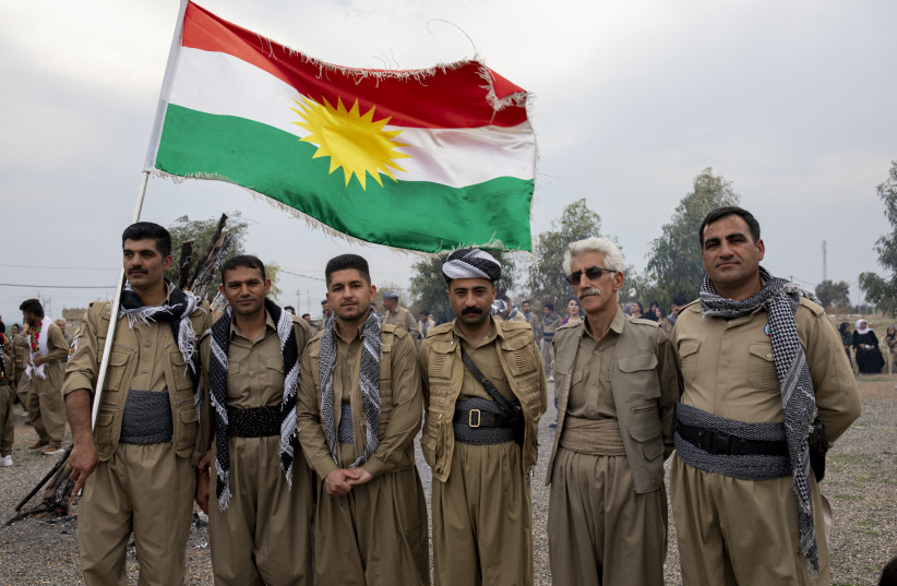 The Democratic Party of Iranian Kurdistan (PDKI) members pose for the camera as they celebrate Nowruz at the Jezhnikan Village around Baharka, Iraq, on March 18, 2025.