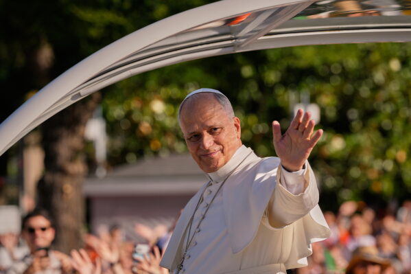 Pope Leo XIV arrives in the popemobile at Plaza de Cibeles for a Holy Mass and Corpus Christi procession in Madrid, Spain, Sunday, June 7, 2026, on the second day of his seven-day apostolic visit to mainland Spain and the Canary Islands. (AP Photo/Bernat Armangue)