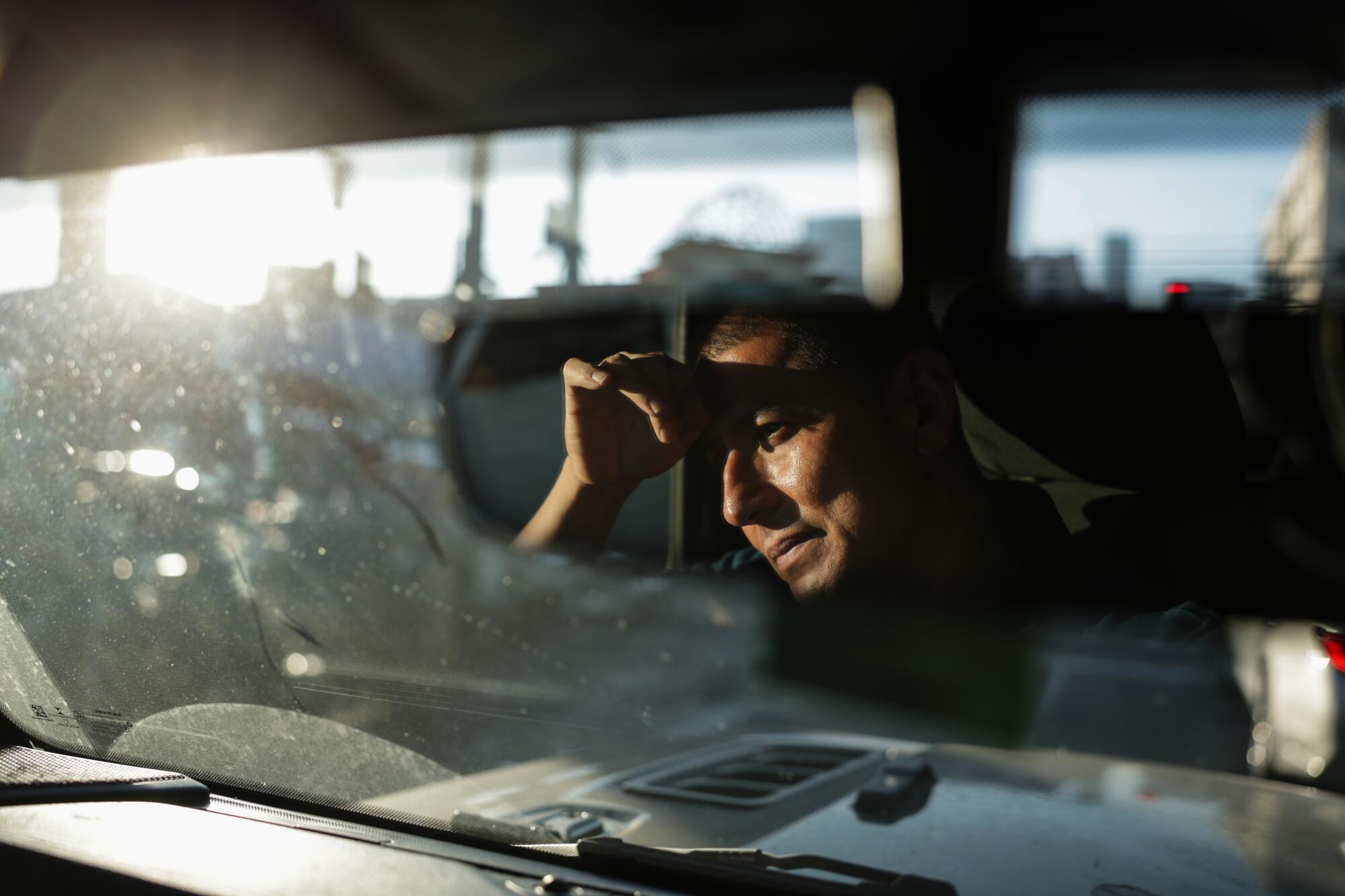Joel Galvez drives along the street