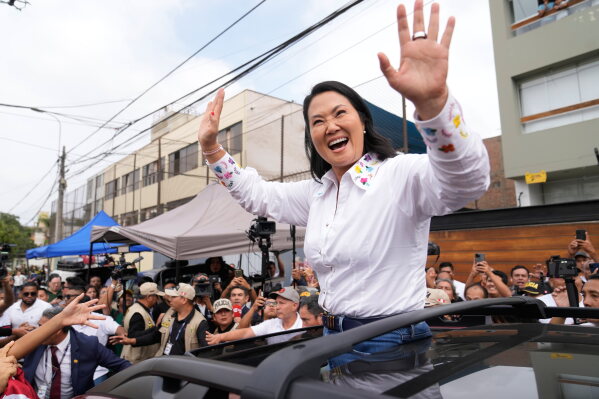 Presidential candidate Keiko Fujimori, of the Popular Force party, waves after voting during the presidential runoff election in Lima, Peru, Sunday, June 7, 2026. (AP Photo/Martin Mejia)