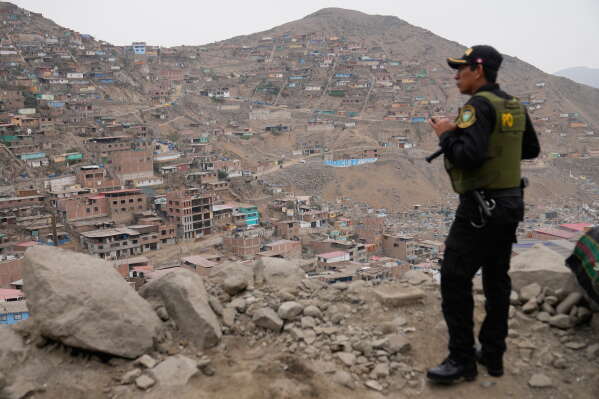 A police officers guard the site where presidential candidate Keiko Fujimori of the Popular Force party meets supporters for breakfast during the presidential runoff election in Lima, Peru, Sunday, June 7, 2026. (AP Photo/Martin Mejia)