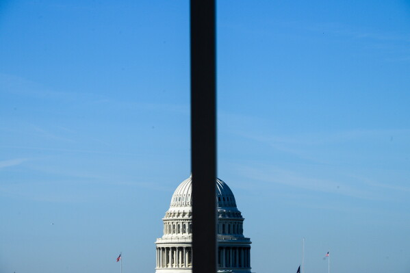 The U.S. Capitol is seen behind a light pole, on Capitol Hill in Washington, Wednesday, June 3, 2026. (AP Photo/Cliff Owen)