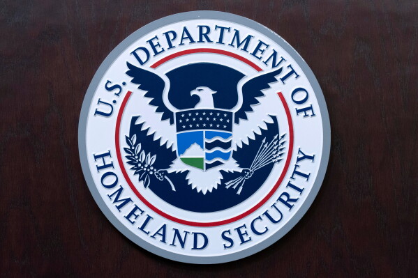 The seal of U.S. Department of Homeland Security is seen before a news conference at ICE Headquarters in Washington, May 21, 2025. (AP Photo/Jose Luis Magana, File)
