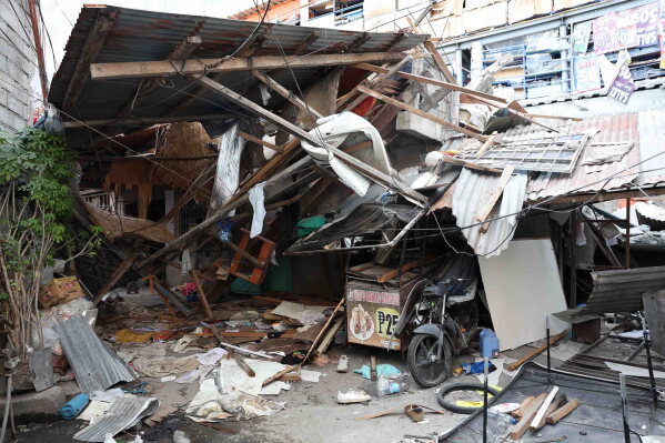 Damaged houses are seen following an earthquake in General Santos, Philippines Tuesday, June 9, 2026. (AP Photo/Basilio Sepe)
