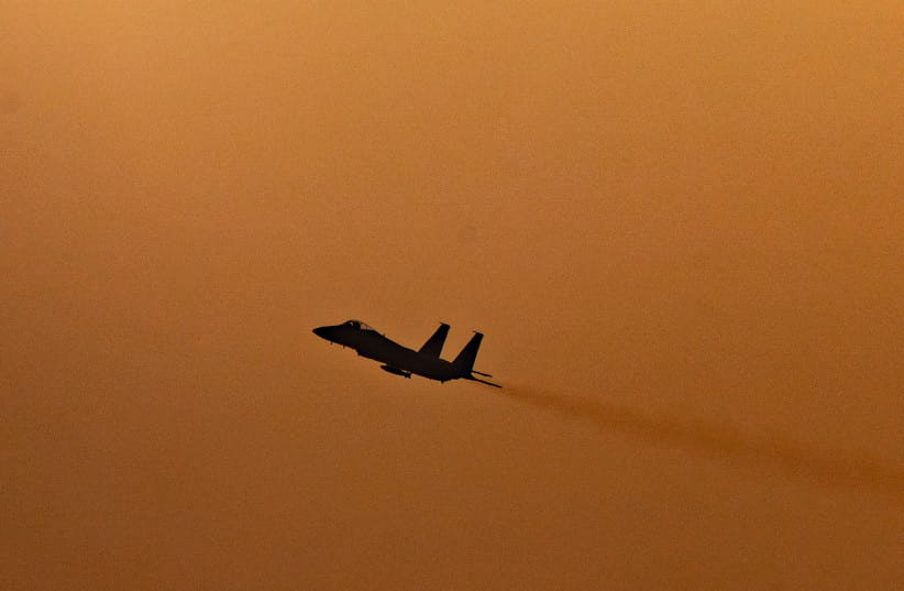 An Israeli Air Force fighter jet flies over central Israel amid the ongoing war between Israel, Iran and Hezbollah, March 12, 2026.