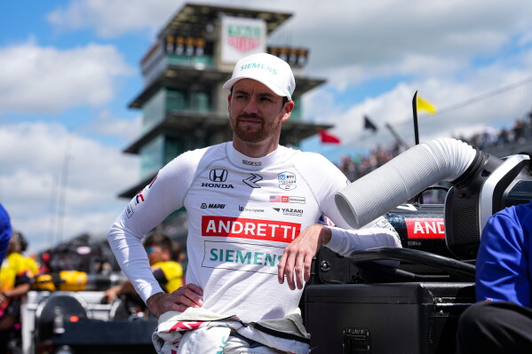 Kyle Kirkwood leans on a tool box as he waits for is turn during qualification for the Indianapolis 500 auto race at Indianapolis Motor Speedway in Indianapolis, May 17, 2025. (AP Photo/Michael Conroy, File)