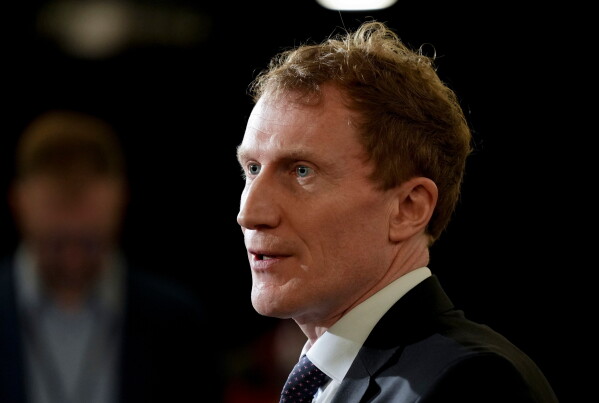 Canada's Minister of Immigration, Refugees and Citizenship Marc Miller speaks to the media during the federal cabinet retreat in Montreal, Monday, Jan. 22, 2024. (Christinne Muschi/The Canadian Press via AP,File)