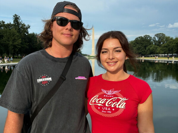 Jacob Burvis and Ellie Louizes, from Daytona Beach Fla., pose for a photo at the Lincoln Memorial, Friday, June 12, 2026, in Washington. (AP Photo/Fatima Hussein)