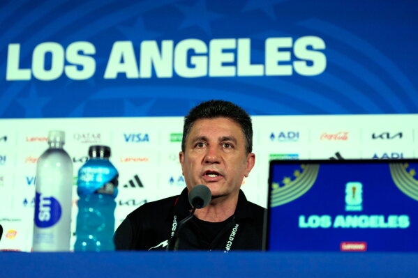 Iran head coach Amir Ghalehnoy speaks during a press conference ahead of his FIFA World Cup match against New Zealand in Inglewood, Calif., near Los Angeles, Sunday, June 14, 2026. (AP Photo/Andre Penner)