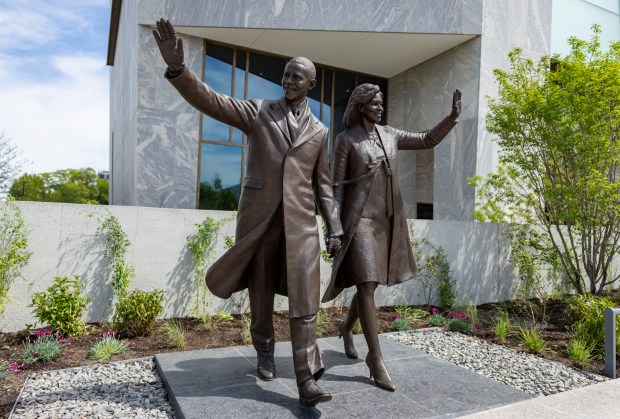 A statue of President Barack Obama and first lady Michelle Obama from the 2009 inauguration greets visitors as the Obama Presidential Center, June 3, 2026, in Chicago's Jackson Park. (Brian Cassella/Chicago Tribune)