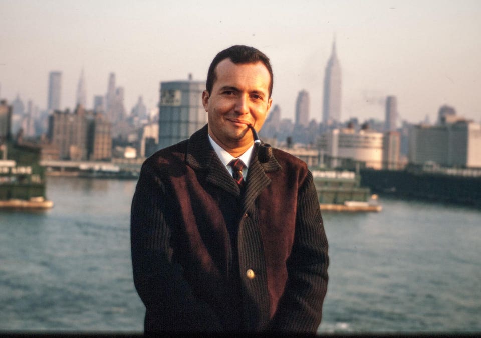 Michel Cojot in New York smoking a pipe