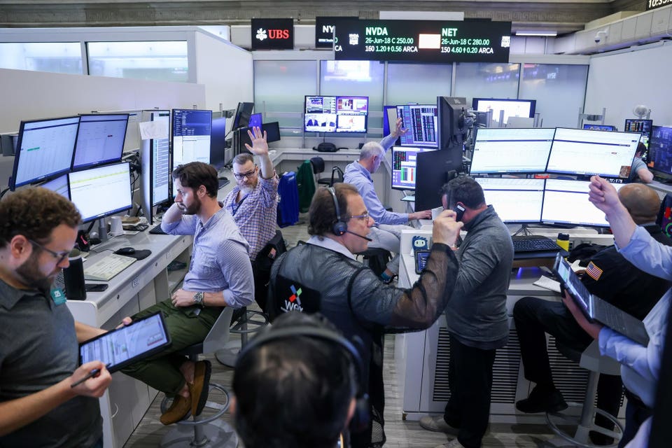 Traders On The Floor Of The New York Stock Exchange As Oil Jumps On Report of Iran-U.S. Ceasefire