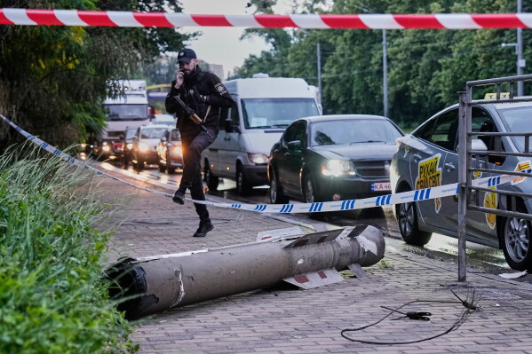 A missile fragment lies on the street following Russia's air attack in Kyiv, Ukraine, Monday, June 15, 2026. (AP Photo//Efrem Lukatsky)