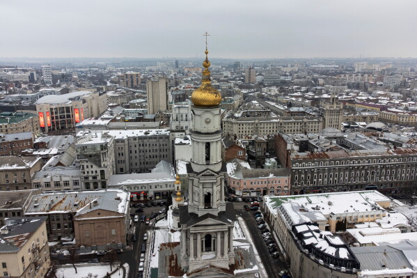 The Assumption or Dormition Cathedral, the main Orthodox church of Kharkov rises above the center of Kharkiv, Ukraine's second-largest city in Ukraine, Friday, Feb. 4, 2022. (AP Photo/Evgeniy Maloletka, File)
