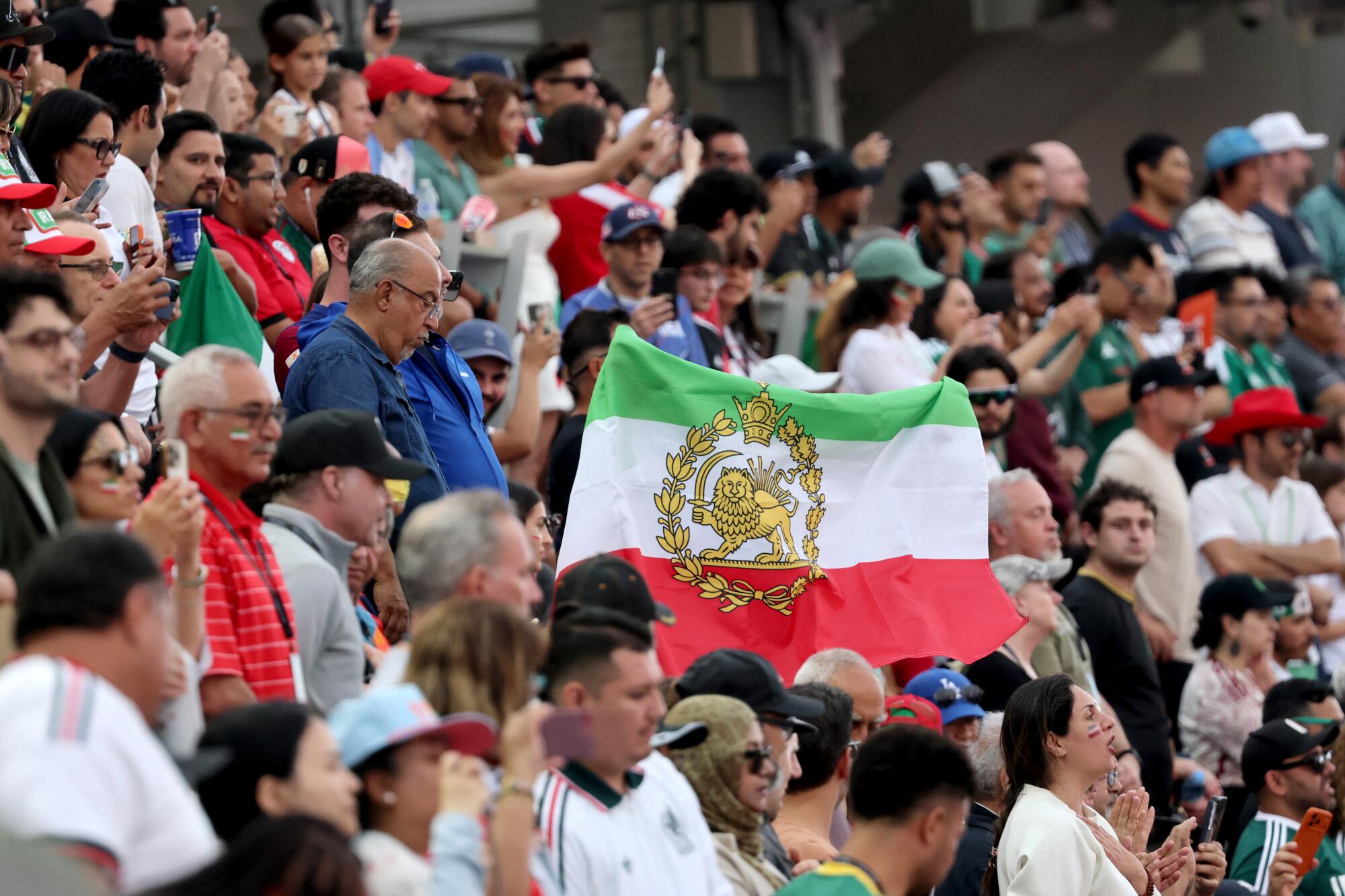 A pre-revolutionary Iranian flag is displayed before the World Cup group stage match between Iran and New Zealand at SoFi.