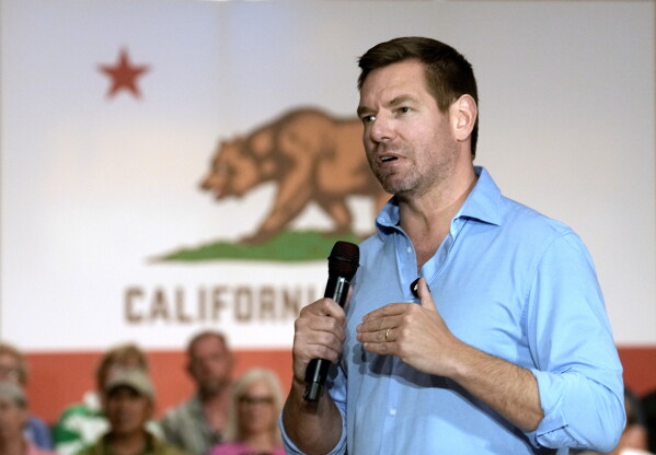 Eric Swalwell appears at a town hall meeting in Sacramento, California, on April 7, 2026. (AP Photo/Rich Pedroncelli)