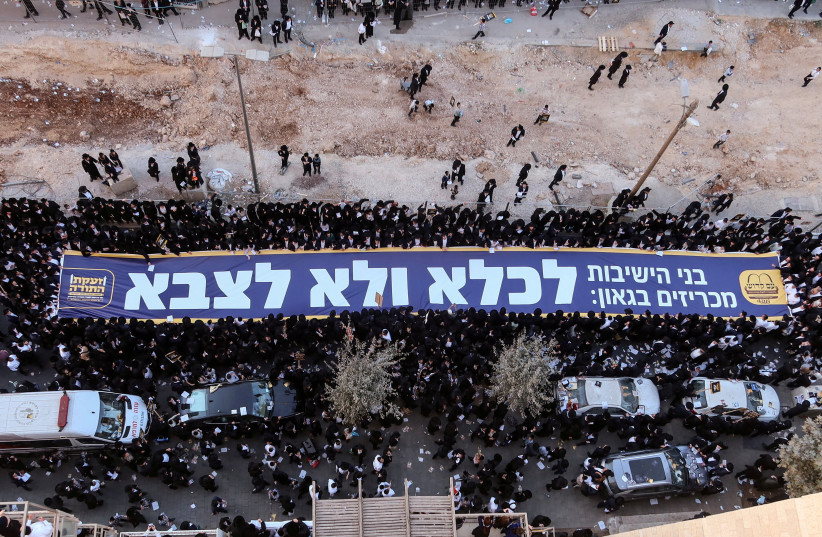 Ultra-Orthodox Jews carry a banner in Hebrew that reads, “to prison and not the army,” during a “million man” protest against military conscription, in Jerusalem October 30, 2025.