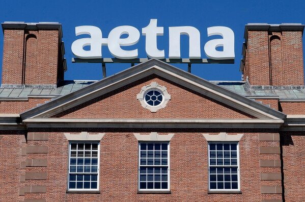 The corporate sign atop Aetna headquarters is seen Aug. 19, 2014, in Hartford, Conn. (AP Photo/Jessica Hill, File)