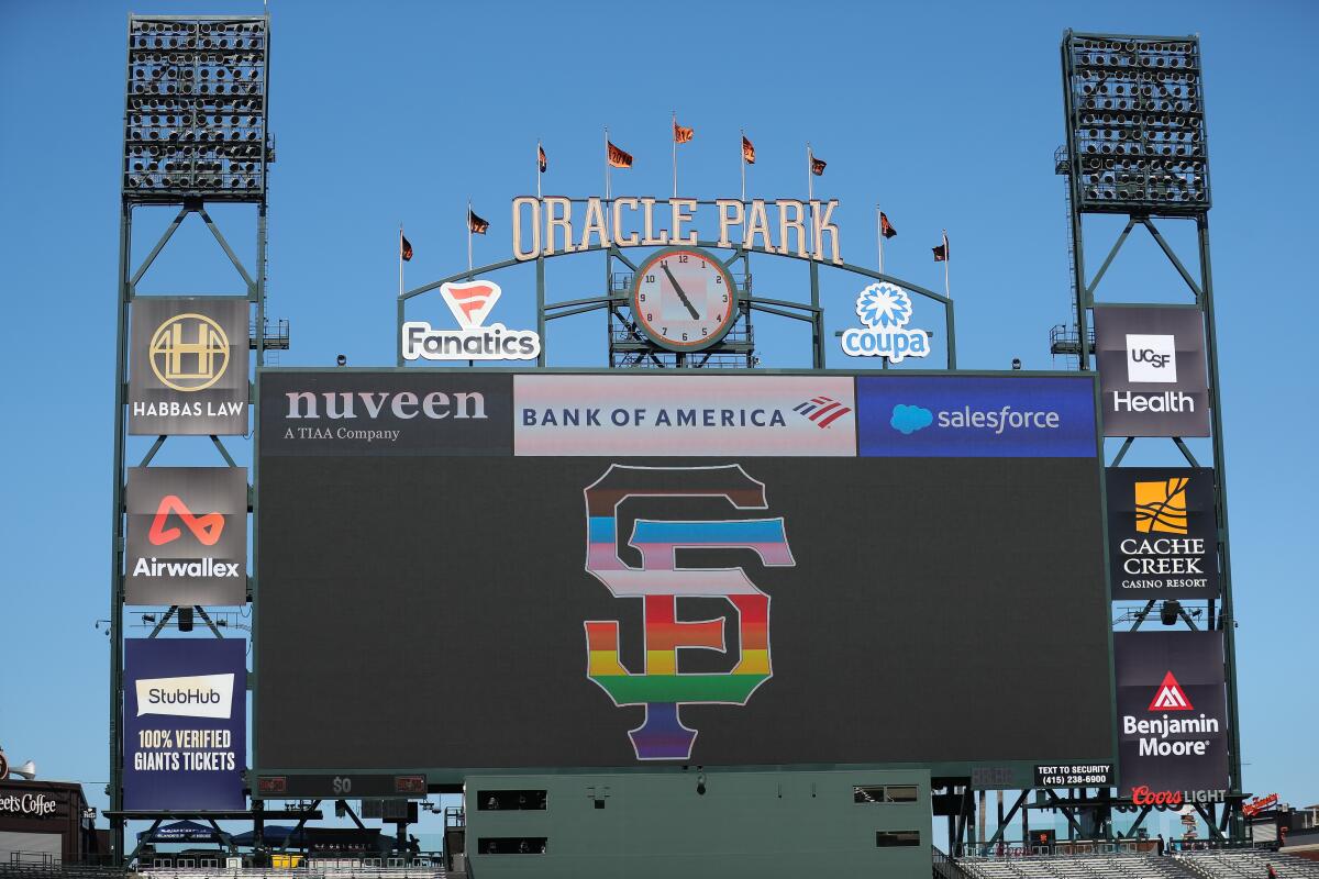 the San Francisco Giants pride logo on the scoreboard 