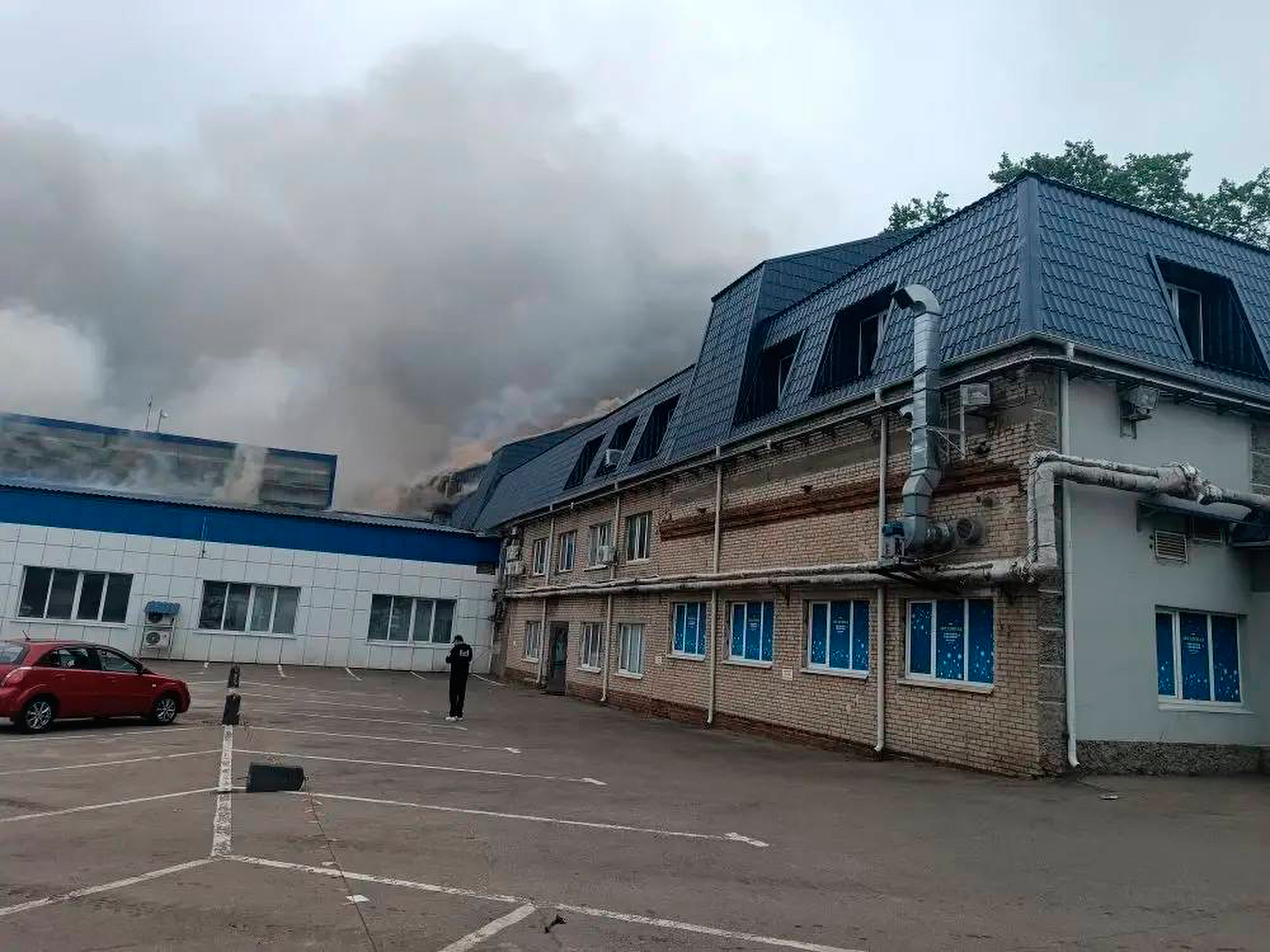 Smoke rises from a damaged building after a Ukrainian drone attack outside Moscow