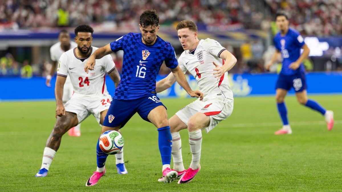 DALLAS, TEXAS - JUNE 17: Elliot Anderson and Reece James of England close in on Martin Baturina of Croatia during the FIFA World Cup 2026 Group L match between England and Croatia at Dallas Stadium on June 17, 2026 in Dallas, United States. (Photo by Simon M Bruty/Getty Images)