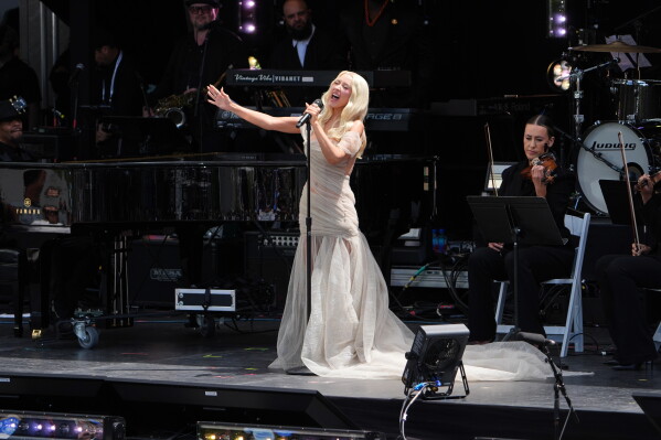 Singer Christina Aguilera performs during the dedication ceremony for the Obama Presidential Center, Thursday, June 18, 2026, in Chicago. (AP Photo/Jeff Roberson)