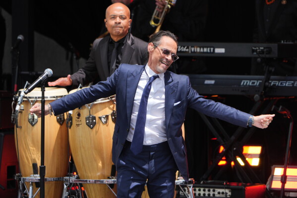 Singer Marc Anthony performs during the dedication ceremony for the Obama Presidential Center, Thursday, June 18, 2026, in Chicago. (AP Photo/Jeff Roberson)