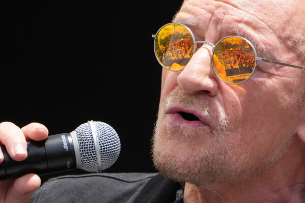 Singer Bono from the Rock Band U2 performing at the dedication ceremony for the Obama Presidential Center, Thursday, June 18, 2026, in Chicago. (AP Photo/Alex Brandon)