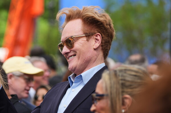 Conan O'Brien mingles ahead of the Obama Presidential Center dedication ceremony Thursday, June 18, 2026, in Chicago. (AP Photo/Alex Brandon)