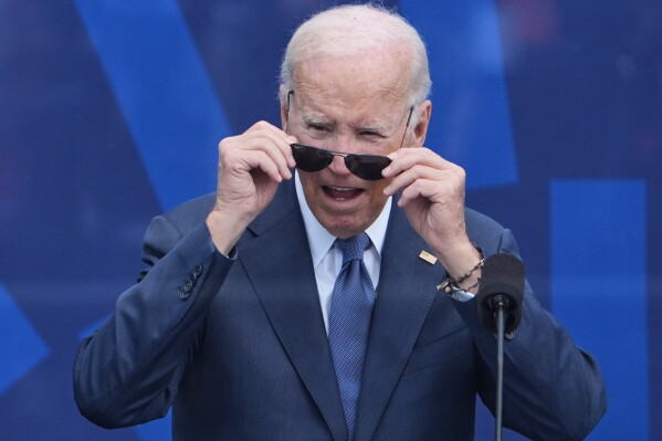 Former President Joe Biden looks out at the crowd during the dedication ceremony for the Obama Presidential Center, Thursday, June 18, 2026, in Chicago. (AP Photo/Jeff Roberson)