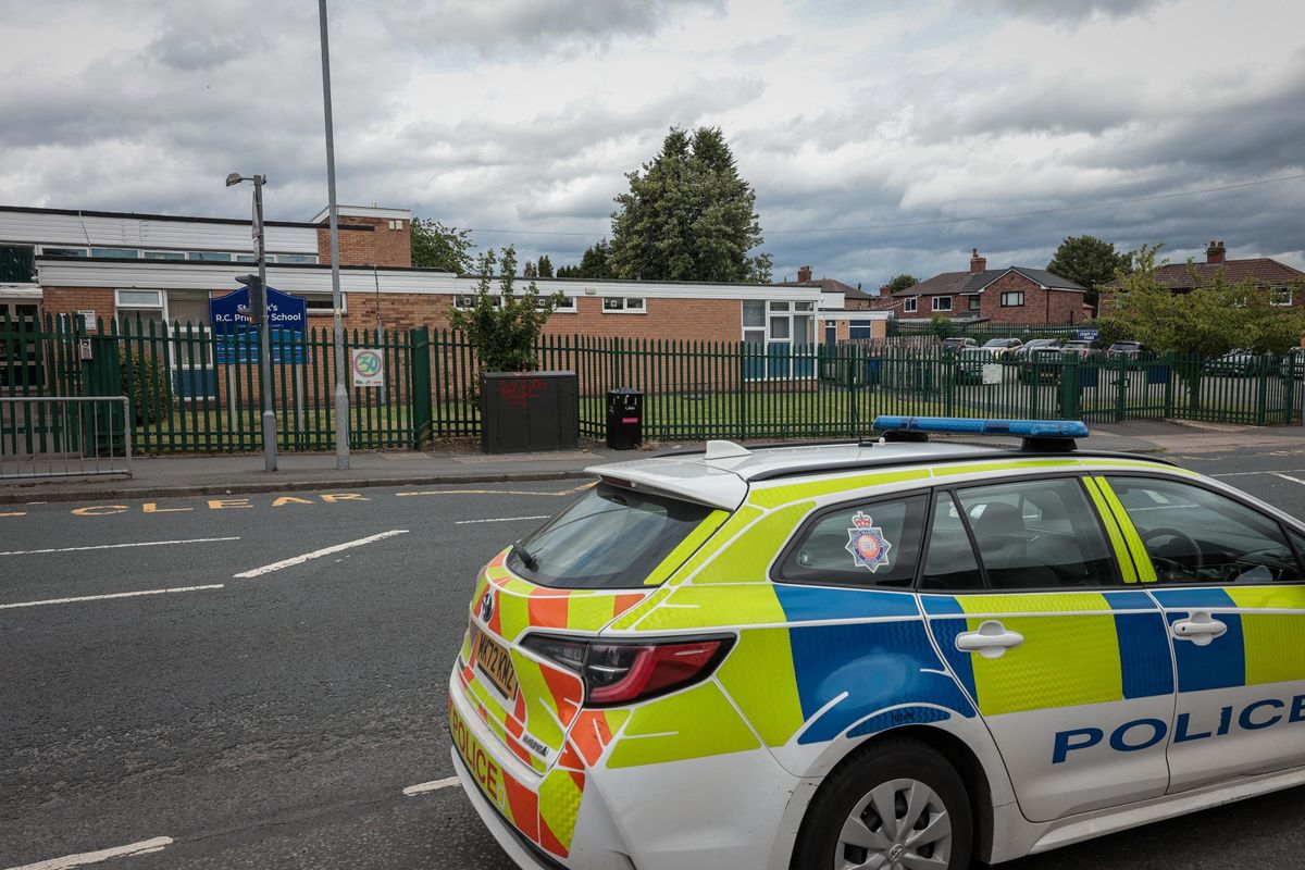 Police outside St Marks R C Primary School in Salford