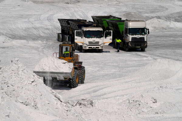 A front-end loader transports phosphogypsum in Phalaborwa, South Africa, Monday, Sept. 8, 2025. (AP Photo/Themba Hadebe, File)
