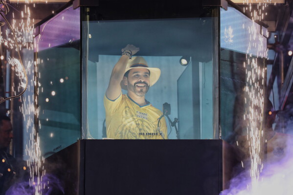 Presidential candidate Abelardo de la Espriella stands before supporters from inside a bulletproof booth during his campaign rally in Buga, Colombia, Sunday, June 14, 2026. (AP Photo/Santiago Saldarriaga)