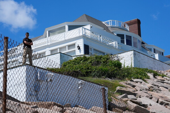 A security guard stands watch at Taylor Swift's "Holiday House," Saturday, June 20, 2026, in Westerly, R.I. (AP Photo/Robert F. Bukaty)