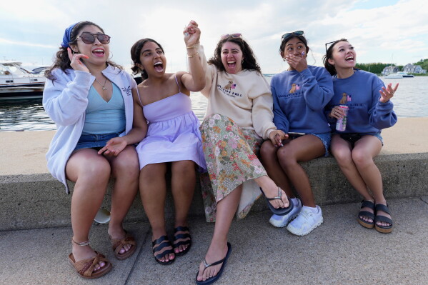 The mention of Taylor Swift's name prompts a reaction from fans visiting Westerly, R.I. on a birthday getaway weekend, Saturday, June 20, 2026, in Westerly, R.I. (AP Photo/Robert F. Bukaty)