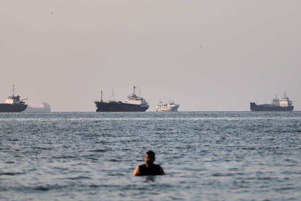 Aerial view of ships navigating the strategic Strait of Hormuz, highlighting its importance to global maritime trade routes