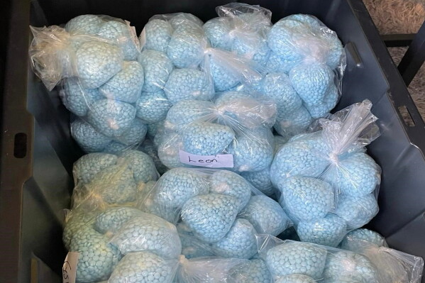 This photo provided by the U.S. Drug Enforcement Administration shows pills containing fentanyl which were seized by the DEA in New Mexico, on April 28, 2025. (DEA via AP)