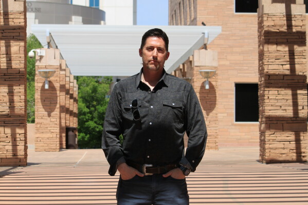 DEA Special Agent David Howell, who filed a whistleblower complaint, poses for a portrait outside the U.S. district courthouse in Albuquerque, N.M., on Friday, June 12, 2026. (AP Photo/Susan Montoya Bryan)