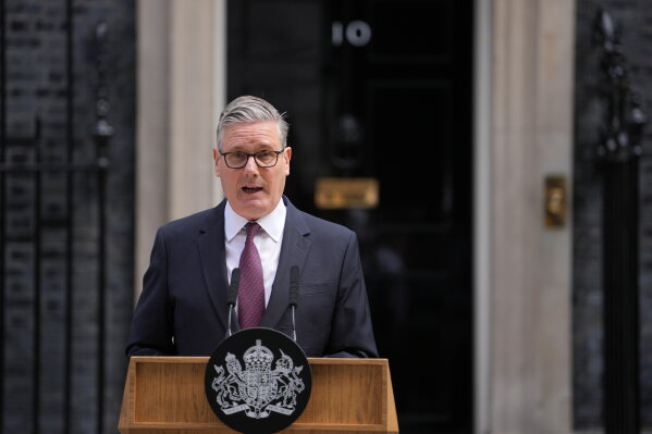 Britain's Prime Minister Keir Starmer announces his resignation to the media outside 10 Downing Street in London, Monday, June 22, 2026. (AP Photo/Kin Cheung)