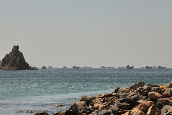 Tankers and cargo vessels are seen in the Gulf of Oman, along shipping routes linking the Strait of Hormuz and the Arabian Sea, Tuesday, June 16, 2026. (AP Photo)