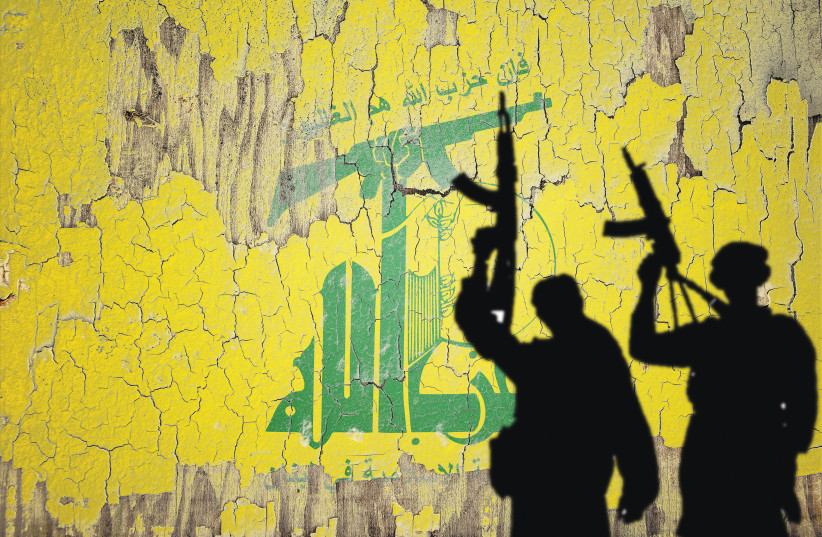 Hezbollah flag mural provides backdrop for gun-wielding shadows.