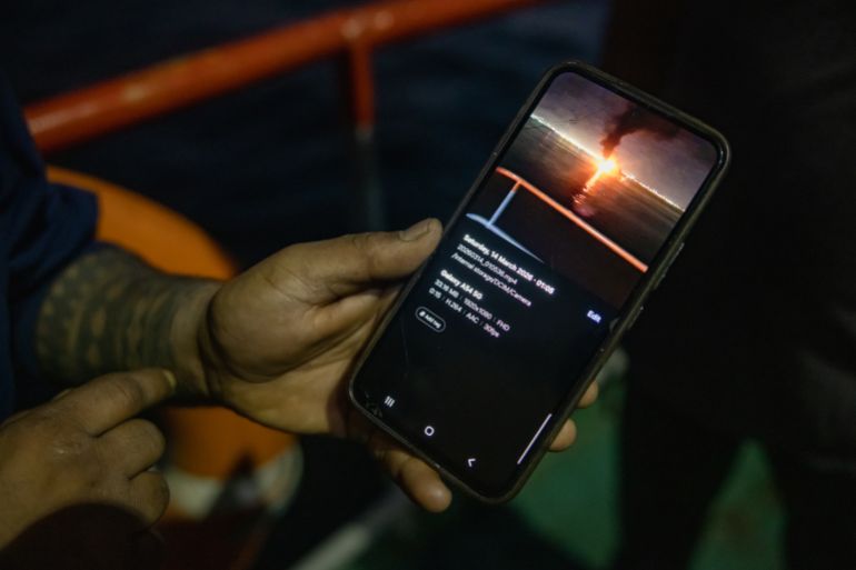 MUSCAT, OMAN - JUNE 23: An Indian sailor shows a picture on his mobile phone of an Iranian missile firing in the Strait of Hormuz on June 23, 2026 in Muscat, Oman. The Strait of Hormuz, a vital shipping route for the region's oil and gas, was effectively blockaded since the outbreak of war between the United States and Iran in late February. This week's provisional peace deal between the countries was meant to reopen the waterway to shipping traffic, but the pace of that reopening is unclear amid continued fighting in Lebanon and the need to clear the Strait of sea mines. On Sunday, U.S. Vice President JD Vance arrived in Switzerland for high-level talks with the Iranian delegation, as the two sides seek to clarify the terms of ending the war. (Photo by Elke Scholiers/Getty Images)