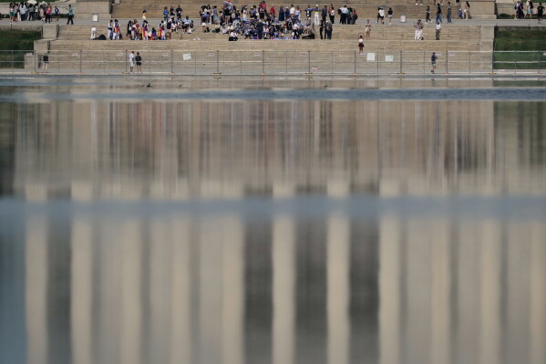 The Lincoln Memorial is reflected in the Lincoln Memorial Reflecting Pool Friday, June 26, 2026, in Washington. (AP Photo/Carolyn Kaster)