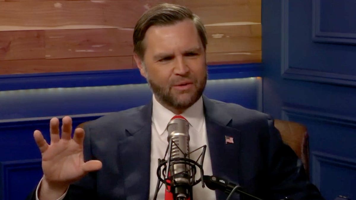 JD Vance speaking into a microphone.