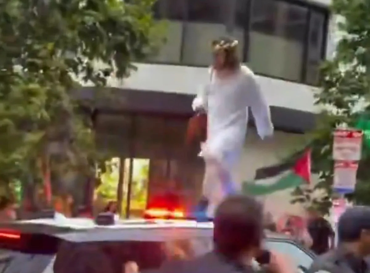Trans March Participant Dressed as Jesus Climbs SFPD Patrol Car as Police Clash With Marchers
